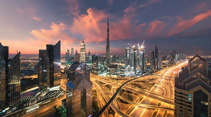 Business Bay vs Downtown Dubai: Dubai skyline with the Burj Khalifa above the Sheikh Zayed Road interchange