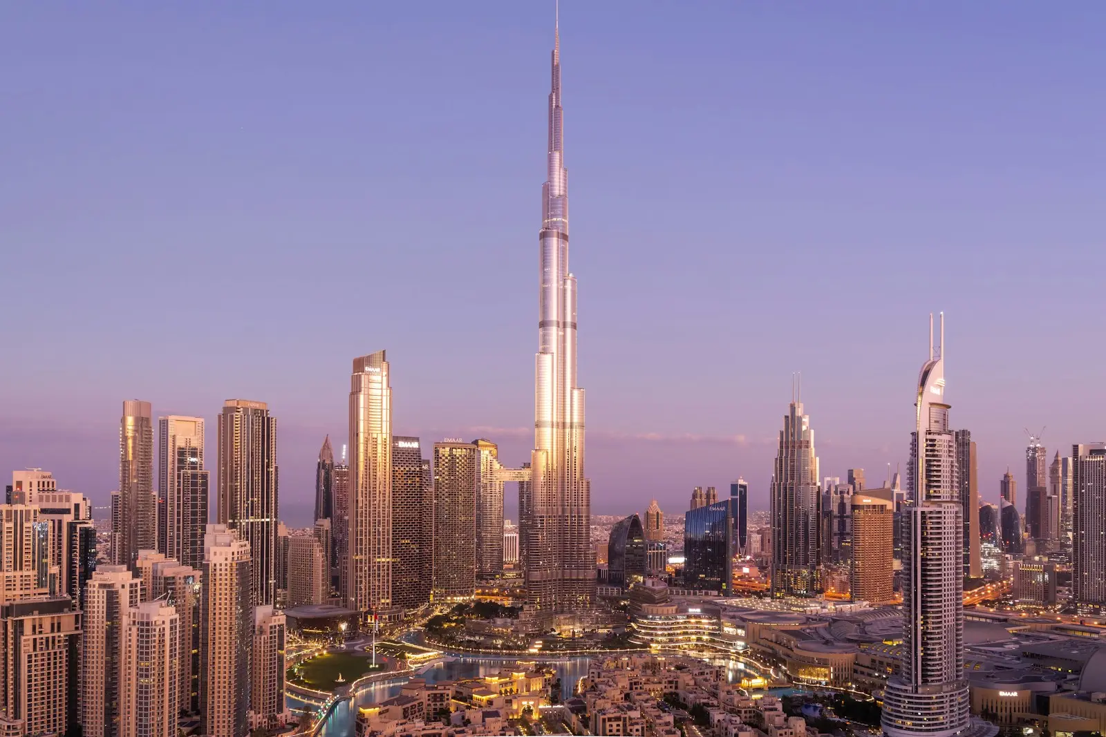 Dubai service charges: residential towers and the Burj Khalifa skyline at dusk