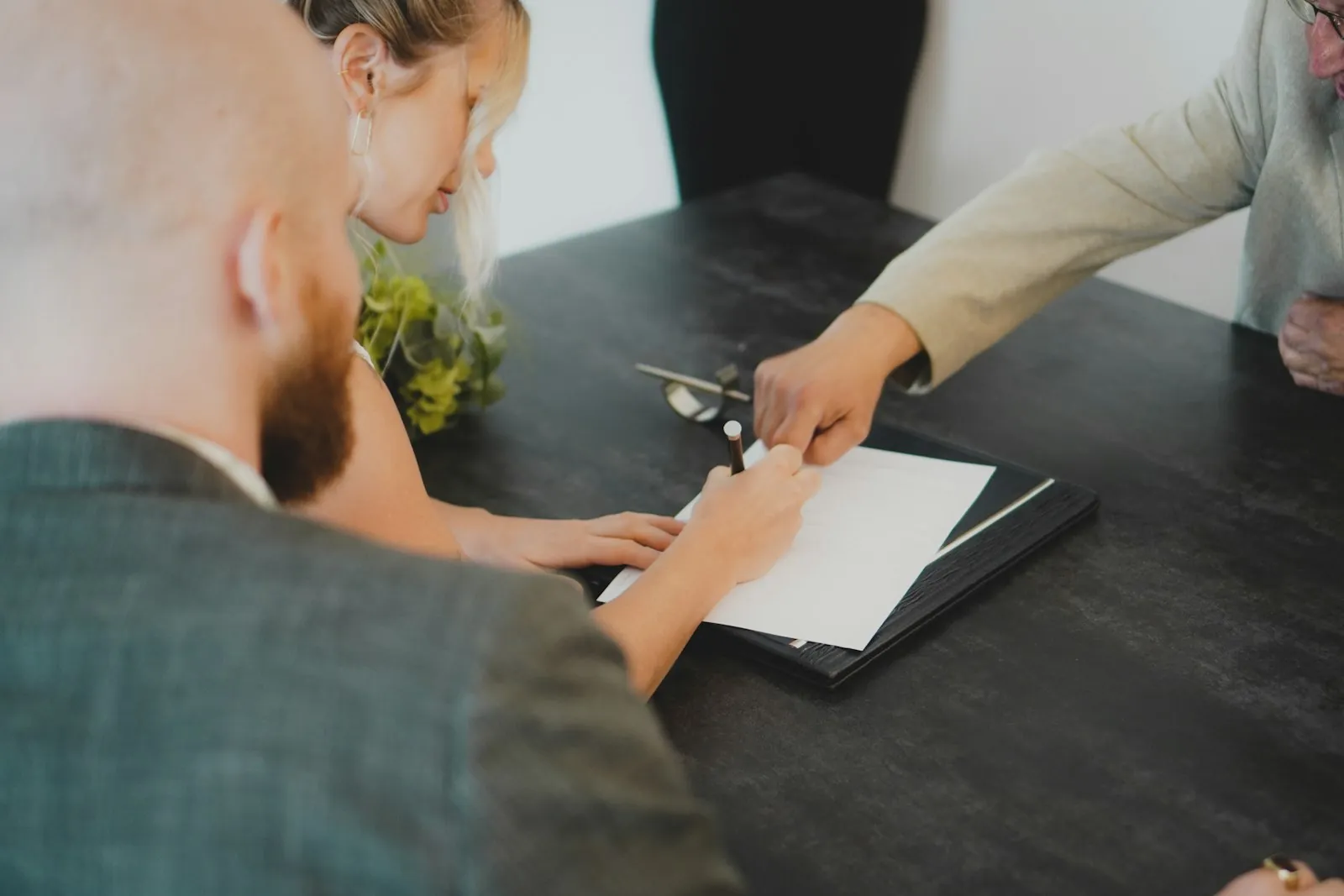 Ejari Dubai: a couple signing a tenancy contract at a desk