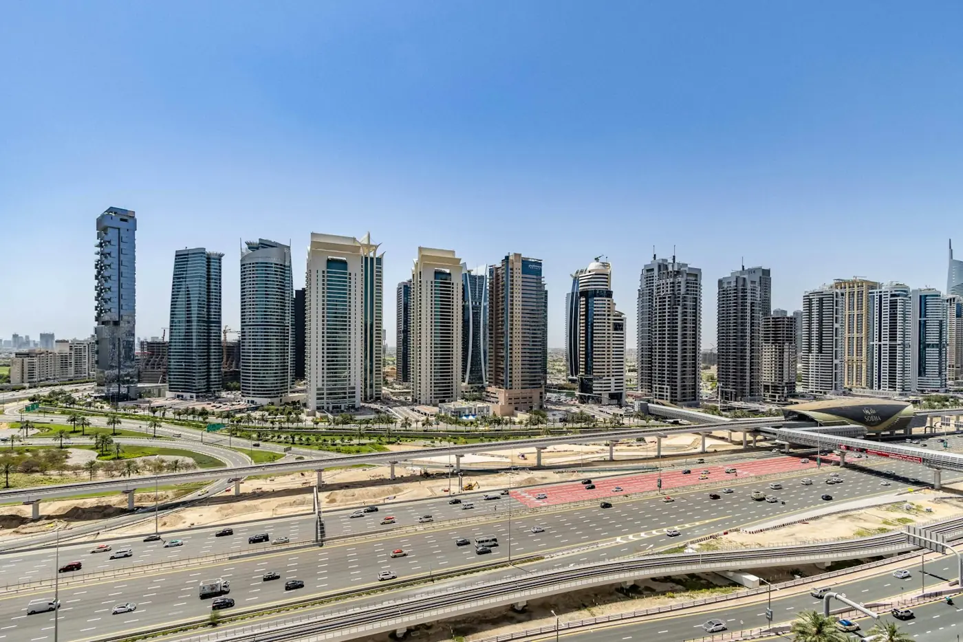 Jumeirah Lakes Towers apartments beside Sheikh Zayed Road and the Dubai Metro in JLT Dubai