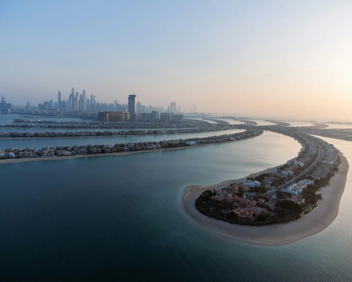 Buy villa in Palm Jumeirah: aerial view of Frond villas and private beaches