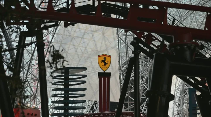 Yas Island property: roller coaster and Ferrari sign inside a Yas Island theme park